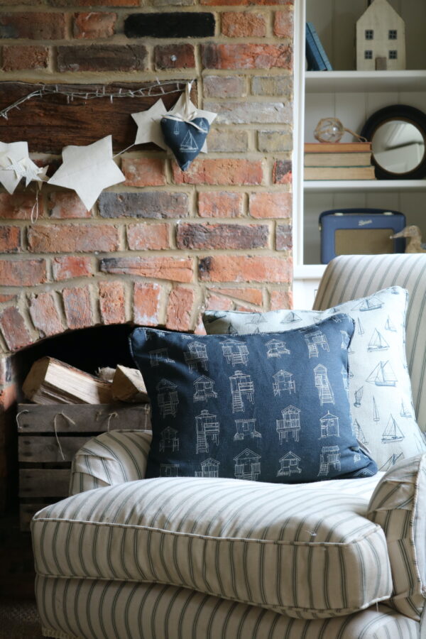Dark blue linen cushion with beach huts from Wells-next-the-Sea